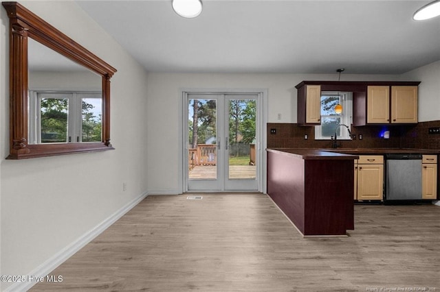 240 Eppingdale Dr, Spring Lake, NC 28390 - kitchen featuring stainless steel dishwasher, dark countertops, light wood finished floors, decorative backsplash, and french doors