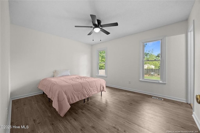 240 Eppingdale Dr, Spring Lake, NC 28390 - bedroom featuring wood finished floors, baseboards, and ceiling fan