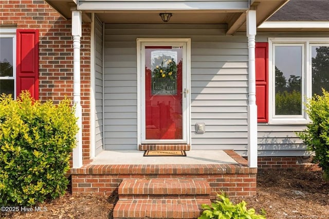 240 Eppingdale Dr, Spring Lake, NC 28390 - view of exterior entry with a porch