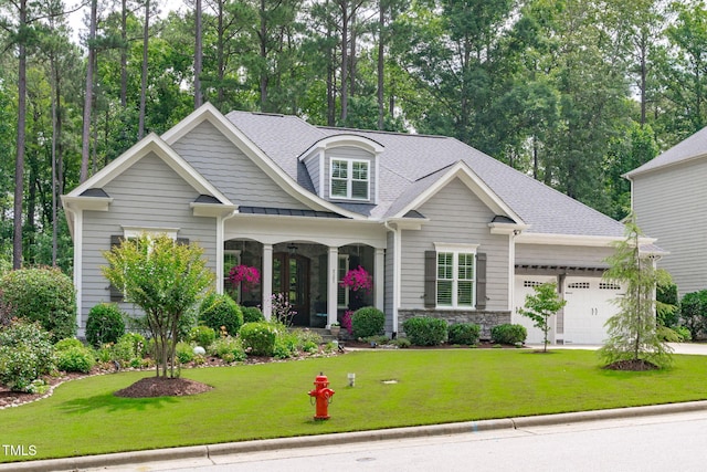 2121 Vecchio Ln, Apex, NC 27502 - craftsman-style home featuring an attached garage, covered porch, a front lawn, and a shingled roof
