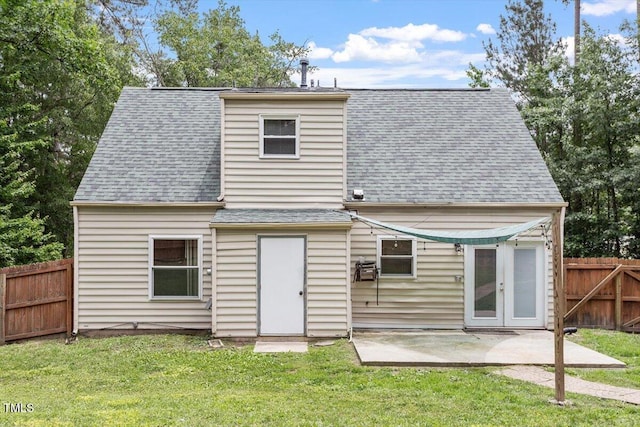 4709 Tyne Dr, Durham, NC 27703 - back of property featuring roof with shingles and a patio