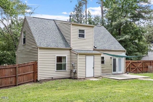 4709 Tyne Dr, Durham, NC 27703 - back of house with a shingled roof and a patio