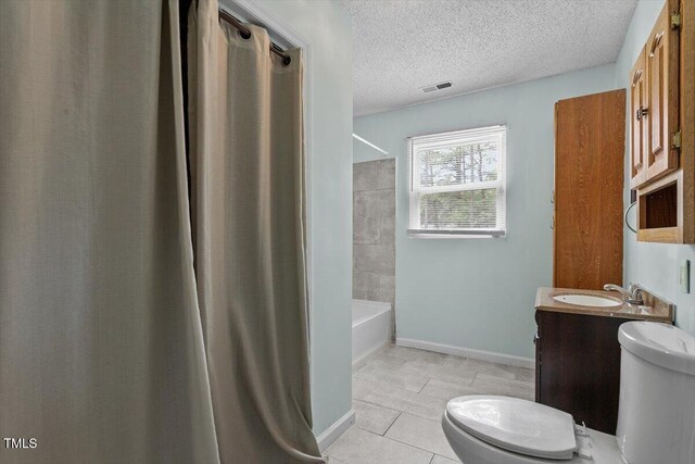 4709 Tyne Dr, Durham, NC 27703 - bathroom with vanity, tile patterned flooring,  shower combination, and a textured ceiling