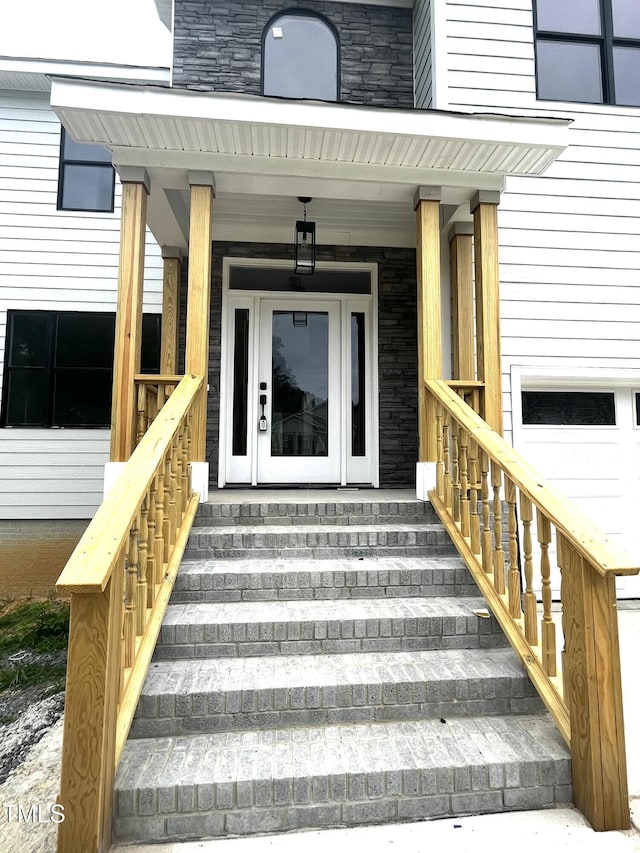 2651 Bowden Dr, Creedmoor, NC 27522 - doorway to property featuring stone siding and a porch