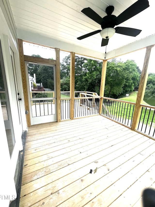 2651 Bowden Dr, Creedmoor, NC 27522 - wooden deck featuring a ceiling fan and view of scattered trees