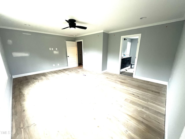2651 Bowden Dr, Creedmoor, NC 27522 - unfurnished bedroom with crown molding, light wood finished floors, ensuite bath, and a ceiling fan