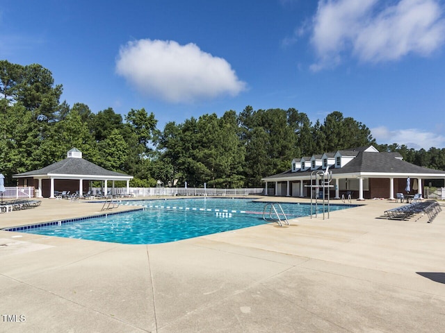 101 Lake Tillery Dr, Cary, NC 27519 - community pool with a patio area, view of wooded area, and a gazebo