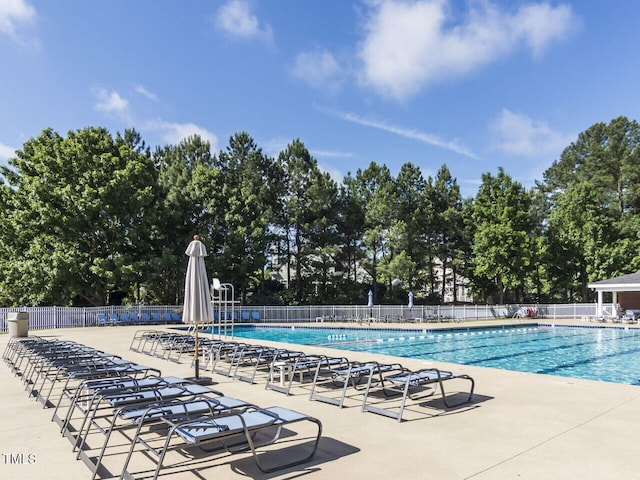 101 Lake Tillery Dr, Cary, NC 27519 - community pool featuring view of scattered trees and a patio area