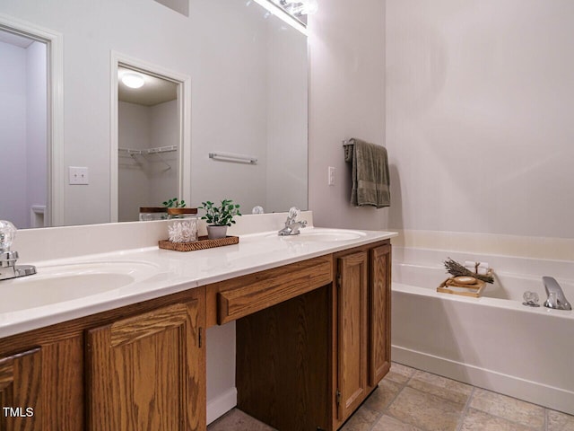 101 Lake Tillery Dr, Cary, NC 27519 - bathroom with double vanity, a garden tub, and a spacious closet