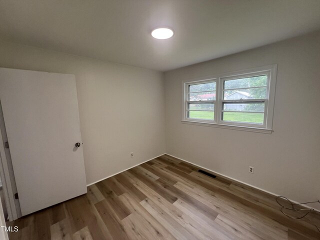 1851 S Clearview Dr, Henderson, NC 27536 - empty room with wood finished floors