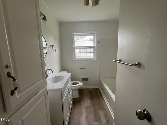 1851 S Clearview Dr, Henderson, NC 27536 - bathroom featuring vanity, wood finished floors, toilet, and baseboards
