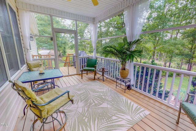 734 Crystal Forest Dr, Semora, NC 27343 - sunroom with ceiling fan and view of scattered trees