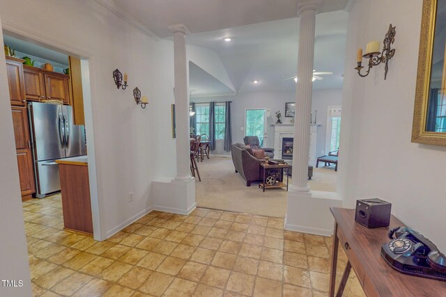 734 Crystal Forest Dr, Semora, NC 27343 - corridor with decorative columns, light stone finish floors, lofted ceiling, and light carpet