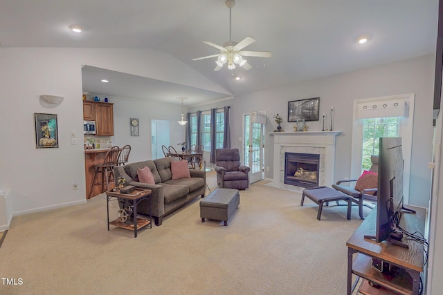 734 Crystal Forest Dr, Semora, NC 27343 - living area featuring light carpet, lofted ceiling, plenty of natural light, ceiling fan, and recessed lighting