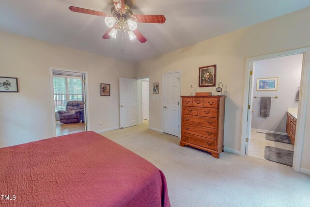 734 Crystal Forest Dr, Semora, NC 27343 - bedroom with light carpet, ensuite bath, and a ceiling fan