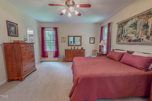 734 Crystal Forest Dr, Semora, NC 27343 - bedroom with light colored carpet and ceiling fan