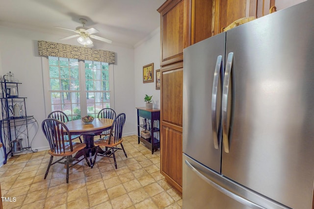 734 Crystal Forest Dr, Semora, NC 27343 - dining room featuring a ceiling fan, ornamental molding, and light stone finish flooring