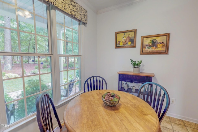 734 Crystal Forest Dr, Semora, NC 27343 - dining area with healthy amount of natural light, ornamental molding, and stone finish floors