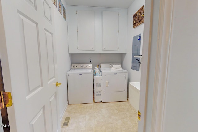 734 Crystal Forest Dr, Semora, NC 27343 - laundry area featuring washing machine and dryer and cabinet space