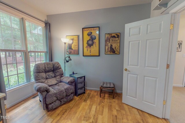 734 Crystal Forest Dr, Semora, NC 27343 - sitting room with light wood-type flooring and baseboards