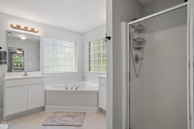 1990 Ferbow St, Creedmoor, NC 27522 - full bathroom with a shower stall, a garden tub, plenty of natural light, and vanity