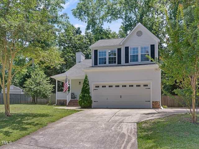 221 Antique Lace Way, Holly Springs, NC 27540 - traditional-style home featuring concrete driveway, an attached garage, covered porch, a chimney, and a shingled roof