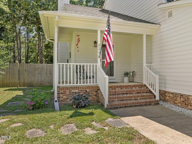 221 Antique Lace Way, Holly Springs, NC 27540 - doorway to property with a porch, a chimney, and roof with shingles