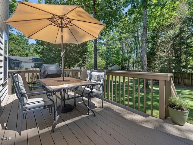 221 Antique Lace Way, Holly Springs, NC 27540 - wooden terrace featuring outdoor dining space, view of wooded area, a grill, and a yard