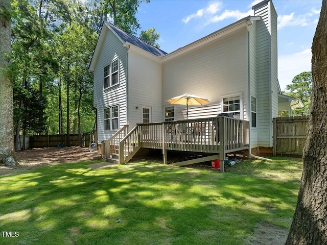 221 Antique Lace Way, Holly Springs, NC 27540 - back of property featuring a chimney and a wooden deck