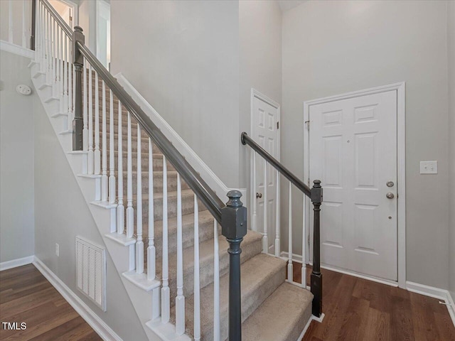 221 Antique Lace Way, Holly Springs, NC 27540 - staircase with wood finished floors and a towering ceiling
