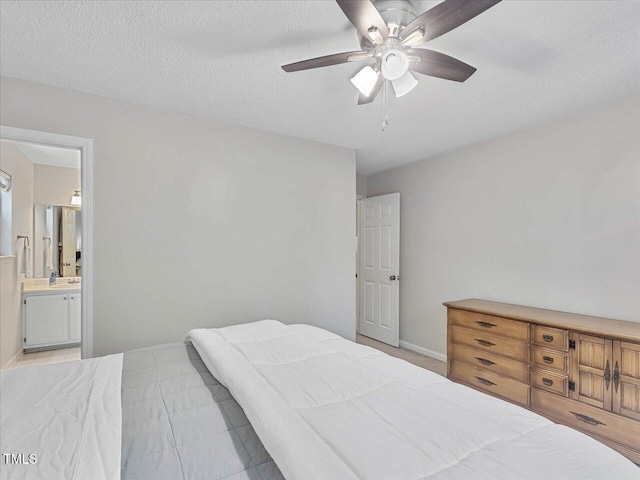 221 Antique Lace Way, Holly Springs, NC 27540 - bedroom with ensuite bathroom, a ceiling fan, and a textured ceiling