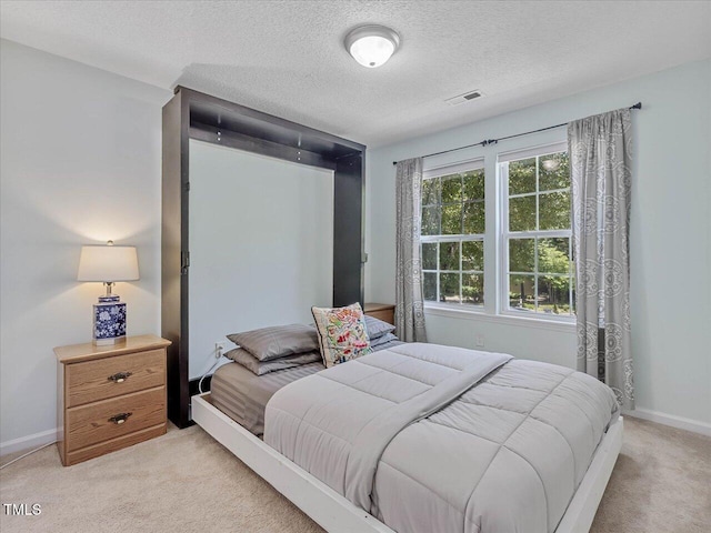 221 Antique Lace Way, Holly Springs, NC 27540 - bedroom featuring light carpet and a textured ceiling
