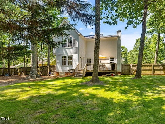 221 Antique Lace Way, Holly Springs, NC 27540 - back of property with a chimney, a wooden deck, and a fenced backyard