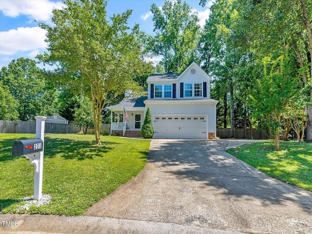221 Antique Lace Way, Holly Springs, NC 27540 - view of front of house with concrete driveway, an attached garage, and a porch