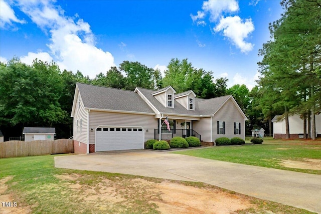 208 N Woodbridge Dr, Pikeville, NC 27863 - new england style home with a porch, a garage, driveway, and a shingled roof