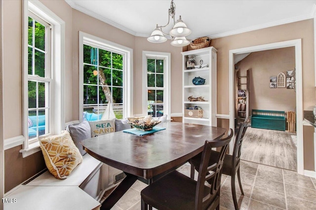 208 N Woodbridge Dr, Pikeville, NC 27863 - dining space featuring a chandelier and crown molding