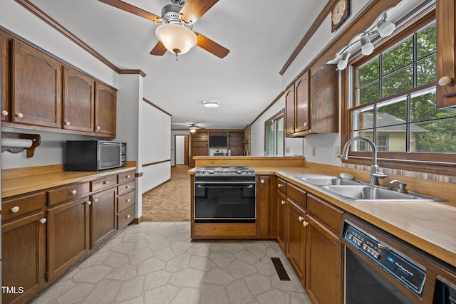 2382 Council Rd, Graham, NC 27253 - kitchen with a ceiling fan, gas stove, dishwasher, light countertops, and ornamental molding
