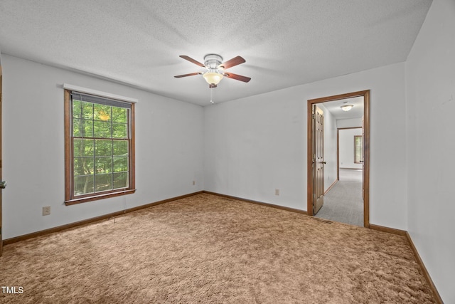 2382 Council Rd, Graham, NC 27253 - empty room featuring carpet floors, a ceiling fan, and a textured ceiling