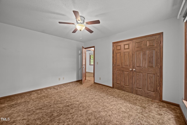 2382 Council Rd, Graham, NC 27253 - unfurnished bedroom with carpet floors, a closet, and a ceiling fan