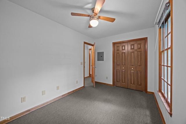 2382 Council Rd, Graham, NC 27253 - unfurnished bedroom featuring electric panel, carpet, ceiling fan, and a closet