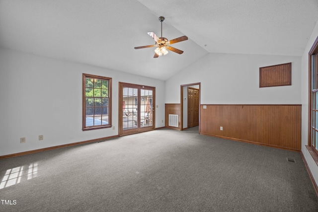 2382 Council Rd, Graham, NC 27253 - carpeted spare room with a wainscoted wall, ceiling fan, lofted ceiling, and wood walls