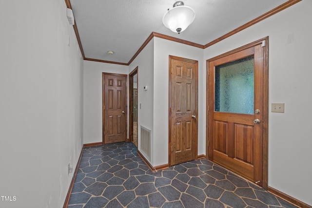 2382 Council Rd, Graham, NC 27253 - entrance foyer featuring ornamental molding, dark colored carpet, and a textured ceiling