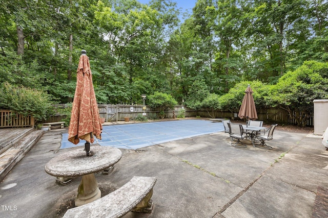 2382 Council Rd, Graham, NC 27253 - view of swimming pool with a fenced backyard, a patio area, view of scattered trees, and outdoor dining space