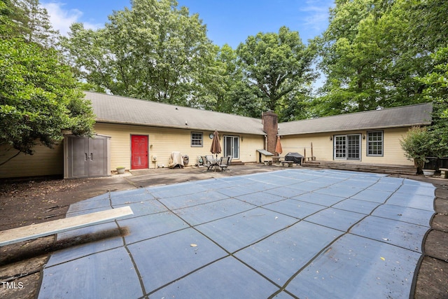 2382 Council Rd, Graham, NC 27253 - back of property with a patio and a covered pool