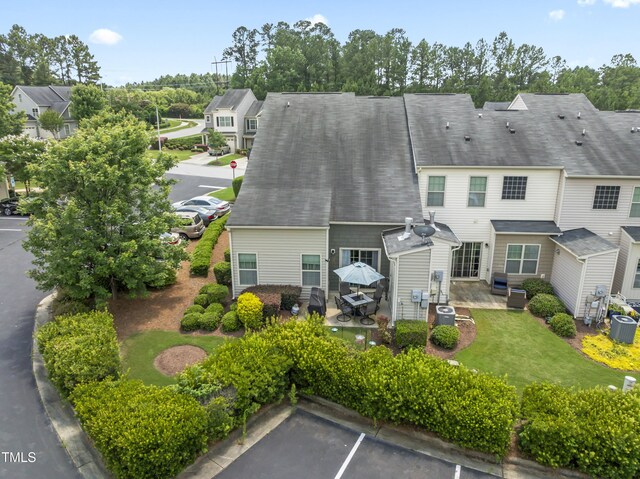 100 Beaconwood Ln, Holly Springs, NC 27540 - rear view of house featuring a patio, uncovered parking, and a residential view
