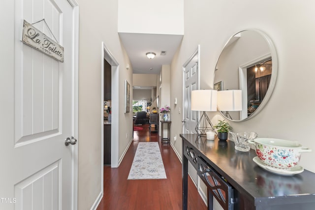100 Beaconwood Ln, Holly Springs, NC 27540 - hallway with dark wood-type flooring and baseboards