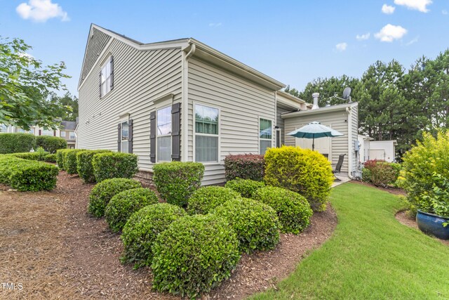 100 Beaconwood Ln, Holly Springs, NC 27540 - view of side of home featuring a yard