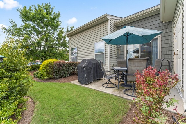 100 Beaconwood Ln, Holly Springs, NC 27540 - view of green lawn featuring a patio area