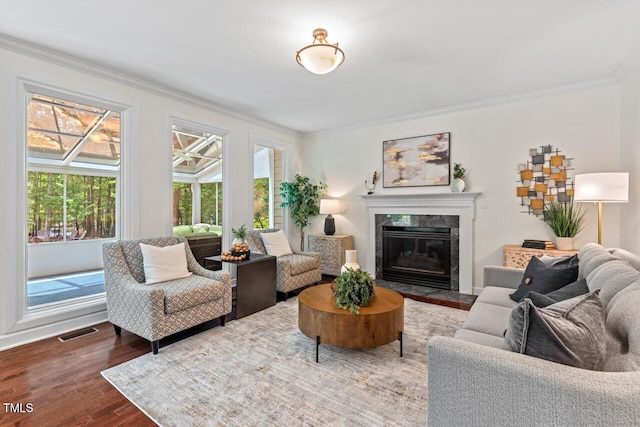 3 White Ash Dr, Durham, NC 27712 - living room with crown molding, a premium fireplace, and wood finished floors