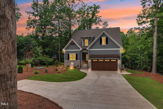 5504 Earle Rd, Raleigh, NC 27606 - craftsman house featuring stone siding, driveway, a front yard, and a garage